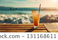 Iced cocktail on sunny beach; cocktail stands on wooden table as cocktail glows in sunset light, crushed ice sparkles, orange slice decor, waves blur behind, vacation mood, summer romance concept 131168611