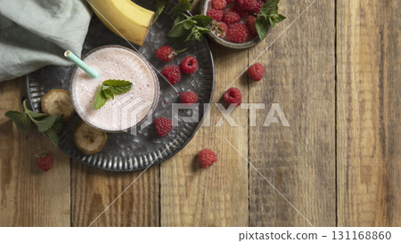 Refreshing banana raspberry smoothie with fresh mint for healthy living and summer enjoyment. Refreshing banana raspberry smoothie with fresh mint for healthy living and summer enjoyment. 131168860