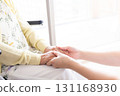 Woman holding senior woman's hand 131168930
