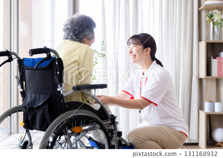 Senior woman and carer in wheelchair Senior woman and carer in wheelchair 131168932