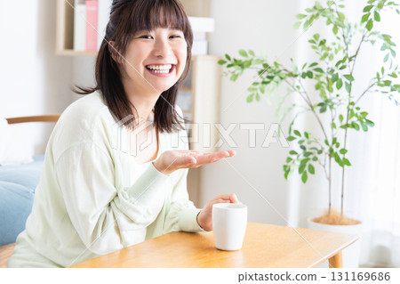 A woman drinking supplements A woman drinking supplements 131169686