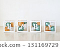 white boxes filled with balloons spelling out BABY in a row, creating a minimalist and celebratory image on a light background. 131169729