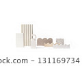 A collection of various abstract, minimalist geometric shapes made of natural materials and neutral colors, arranged on a pure white background. 131169734