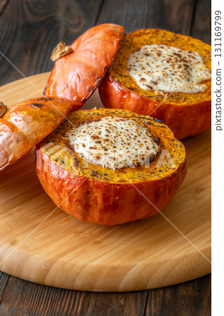 Baked Hokkaido pumpkins filled with beef, tomato sauce, melted mozzarella 131169799