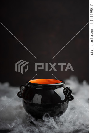 Halloween Cauldron with Pumpkins, Spiders and Cobwebs Halloween Cauldron with Pumpkins, Spiders and Cobwebs 131169907