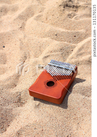 Kalimba on sandy beach Kalimba on sandy beach 131170135