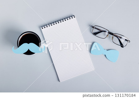 Mustache on coffee mug, notebook, bow tie and glasses, happy father's day 131170184