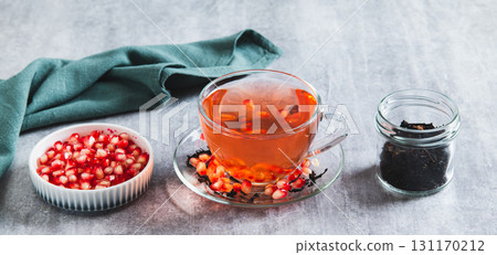 Detox green pomegranate tea in a cup on the table web banner Detox green pomegranate tea in a cup on the table web banner 131170212