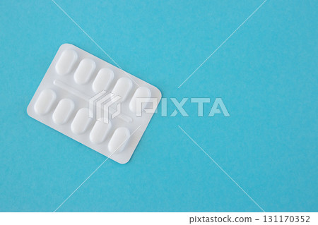 Much medical pills and drugs in white plastic package on the blue background. Healthcare concept wirth space for text. Much medical pills and drugs in white plastic package on the blue background. Healthcare concept wirth space for text. 131170352