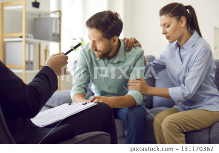 Sad husband and wife experience family problems, need help and go to therapy together Sad husband and wife experience family problems, need help and go to therapy together 131170362