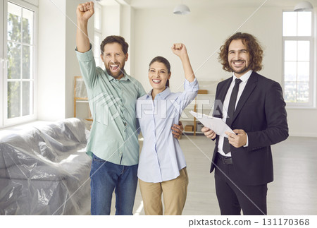 Happy young family couple having fun as they buy new house or apartment together 131170368