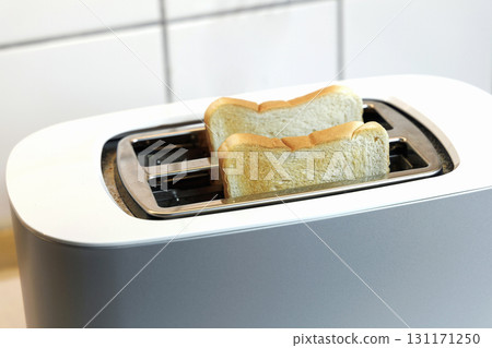 Toaster with two pieces of fried bread Toaster with two pieces of fried bread 131171250