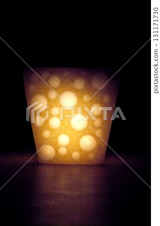 candle in the shape of yellow cheese shine with a fire light candle in the shape of yellow cheese shine with a fire light 131171730