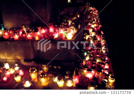 candles lit at night in the cemetery a lot candles lit at night in the cemetery a lot 131171739