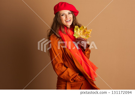 Joyful Woman Holding Autumn Leaves, Fall Fashion 131172094