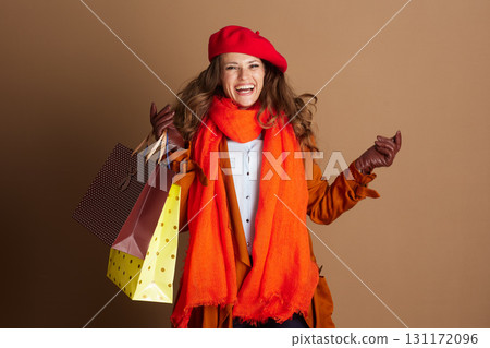 Energetic Woman Laughing with Autumn Shopping Bags 131172096
