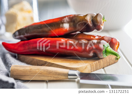 Corno di Toro Rosso pepper. Red paprika vegetable on cutting board. Corno di Toro Rosso pepper. Red paprika vegetable on cutting board. 131172251