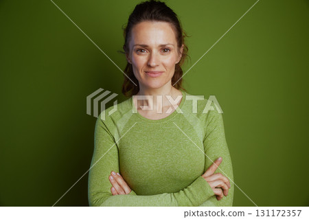 Confident, relaxed woman in green Confident, relaxed woman in green 131172357
