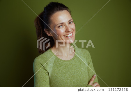 Smiling, friendly woman in green 131172358