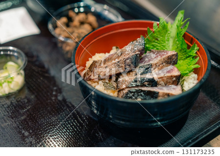 KOCHI, JAPAN - may 2 2025 Seared bonito tataki served on a plate  131173235