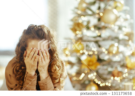 Woman\'s Melancholy Overwhelm During Holiday Season 131173658