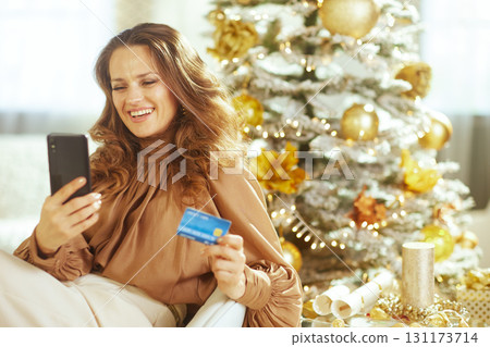 Cozy Christmas: Woman Online Shopping at Home Cozy Christmas: Woman Online Shopping at Home 131173714