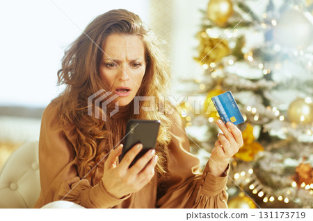 Shocked Woman Facing Holiday Spending Surprise 131173719