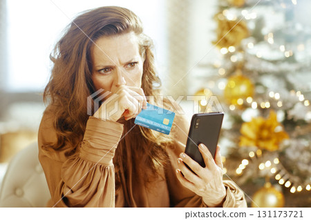 Woman\'s Concerned Holiday Spending Reflection 131173721