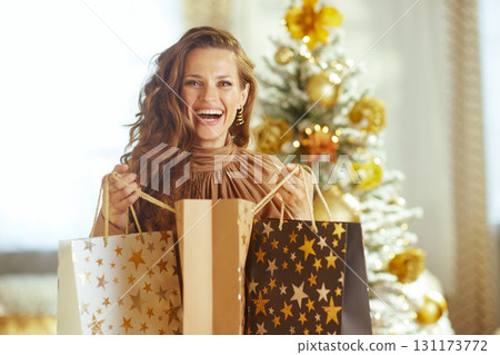 Joyful Holiday Shopper Looks at Camera Joyful Holiday Shopper Looks at Camera 131173772