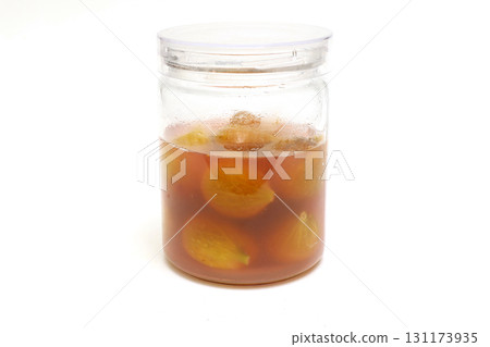 Figs in syrup in a storage container 131173935
