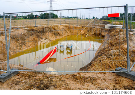 Power cable installation method with pulling cables into corrugated pipes at construction site 131174608