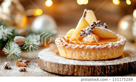 Christmas pear tart with powdered sugar and festive holiday decorations 131175289