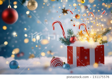 Festive gift box with candy canes and christmas baubles against a magical holiday background 131175576