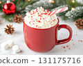 Festive holiday hot chocolate with marshmallows and candy cane 131175716
