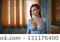 Half-length portrait of seductive curvy redhead caucasian young woman in tight grey dress with low neckline looking at camera indoors on empty bedroom blurred background. Digital art illustration. 131176400