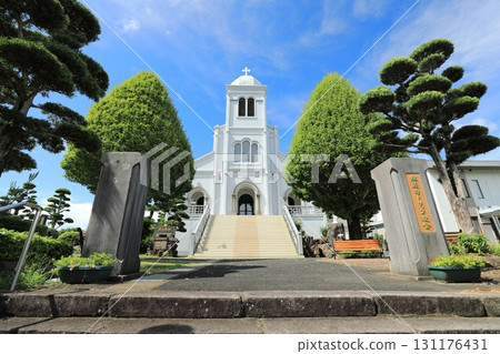 A clear summer sky and lush greenery at the Catholic Himosashi Church (Hirado City, Nagasaki Prefecture, Japan) A clear summer sky and lush greenery at the Catholic Himosashi Church (Hirado City, Nagasaki Prefecture, Japan) 131176431