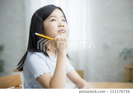 Elementary school girl studying Elementary school girl studying 131176736