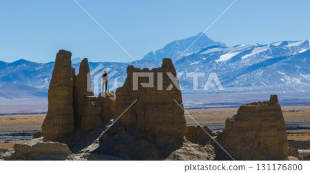 Successful woman hiker taking photo wiith Mount Everest in Tibet, China 131176800