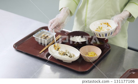 Asian chef preparing meals for caregivers 131177106