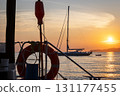 Sailboat on the sea by sunset 131177455