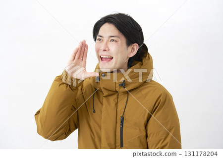 A man wearing a down jacket talking, facing left, white background A man wearing a down jacket talking, facing left, white background 131178204