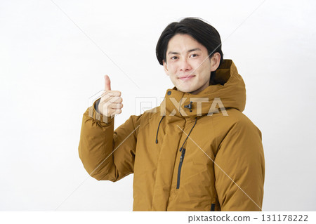Man wearing down jacket, good sign, white background Man wearing down jacket, good sign, white background 131178222