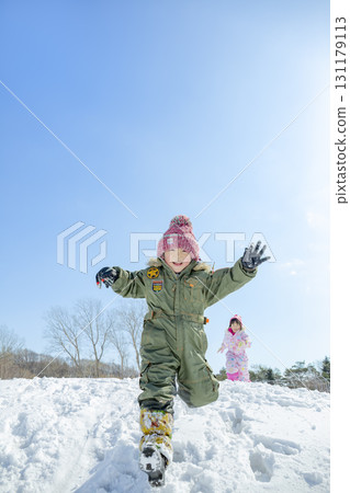 Children playing in the snow in the winter park Children playing in the snow in the winter park 131179113