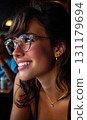 Contemporary concept: Trendy spectacles, bold fashion, light contrast, facial detail, glossy surface, urban ambiance, confident attitude, structured scene, minimal glare, creative perspective 131179694
