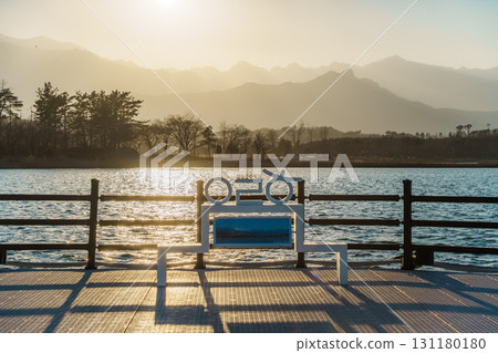 Sunset Bench and Mountain Silhouettes at Yeongrang Lake, Sokcho, South Korea Sunset Bench and Mountain Silhouettes at Yeongrang Lake, Sokcho, South Korea 131180180