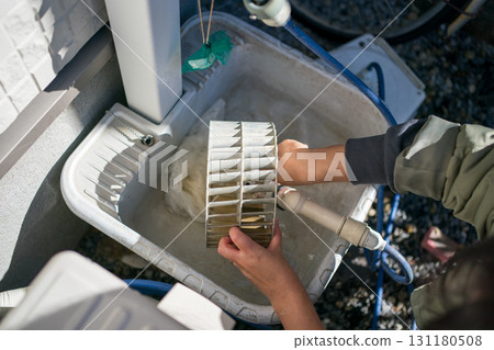 Cleaning the ventilation fan in the kitchen 131180508