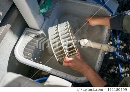 Cleaning the ventilation fan in the kitchen Cleaning the ventilation fan in the kitchen 131180509
