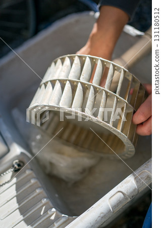 Cleaning the ventilation fan in the kitchen Cleaning the ventilation fan in the kitchen 131180512