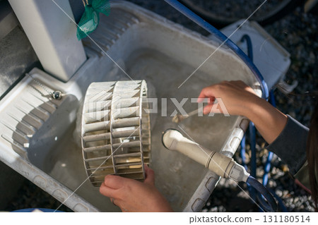 Cleaning the ventilation fan in the kitchen Cleaning the ventilation fan in the kitchen 131180514