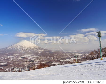 Niseko Tokyu Grand Hirafu in the winter season, with a view of Mt. Yotei from near Earth Hill 131180640